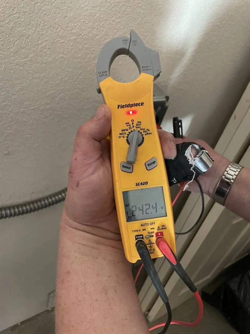 Voltage testing with clamp meter during Circuit Breaker Repair in Clinton